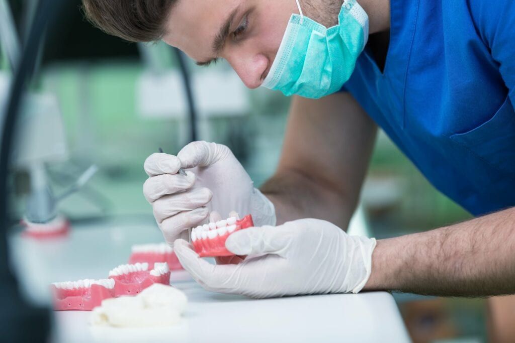man fabricating dental restoration